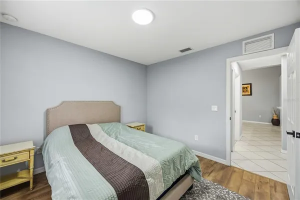 a bedroom with a bed and a view of bedroom