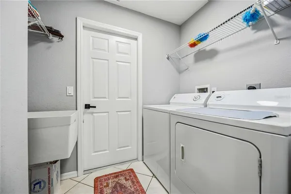 a utility room with dryer and washer