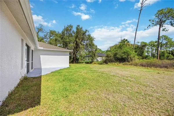a view of a back yard of the house