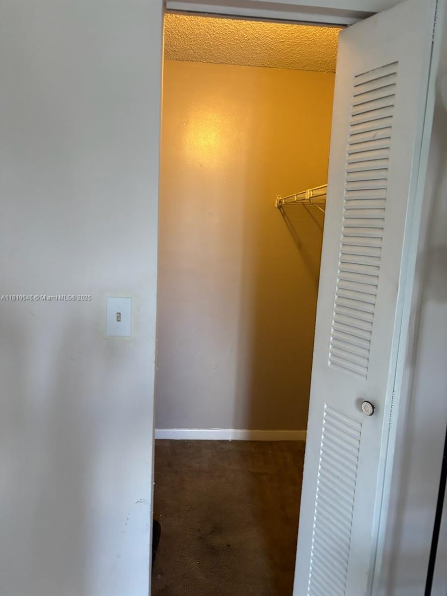 7125 Northwest 186th Street, Unit B311 Hialeah, FL 33015 - Photo 6 of 31 a bathroom with a shower
