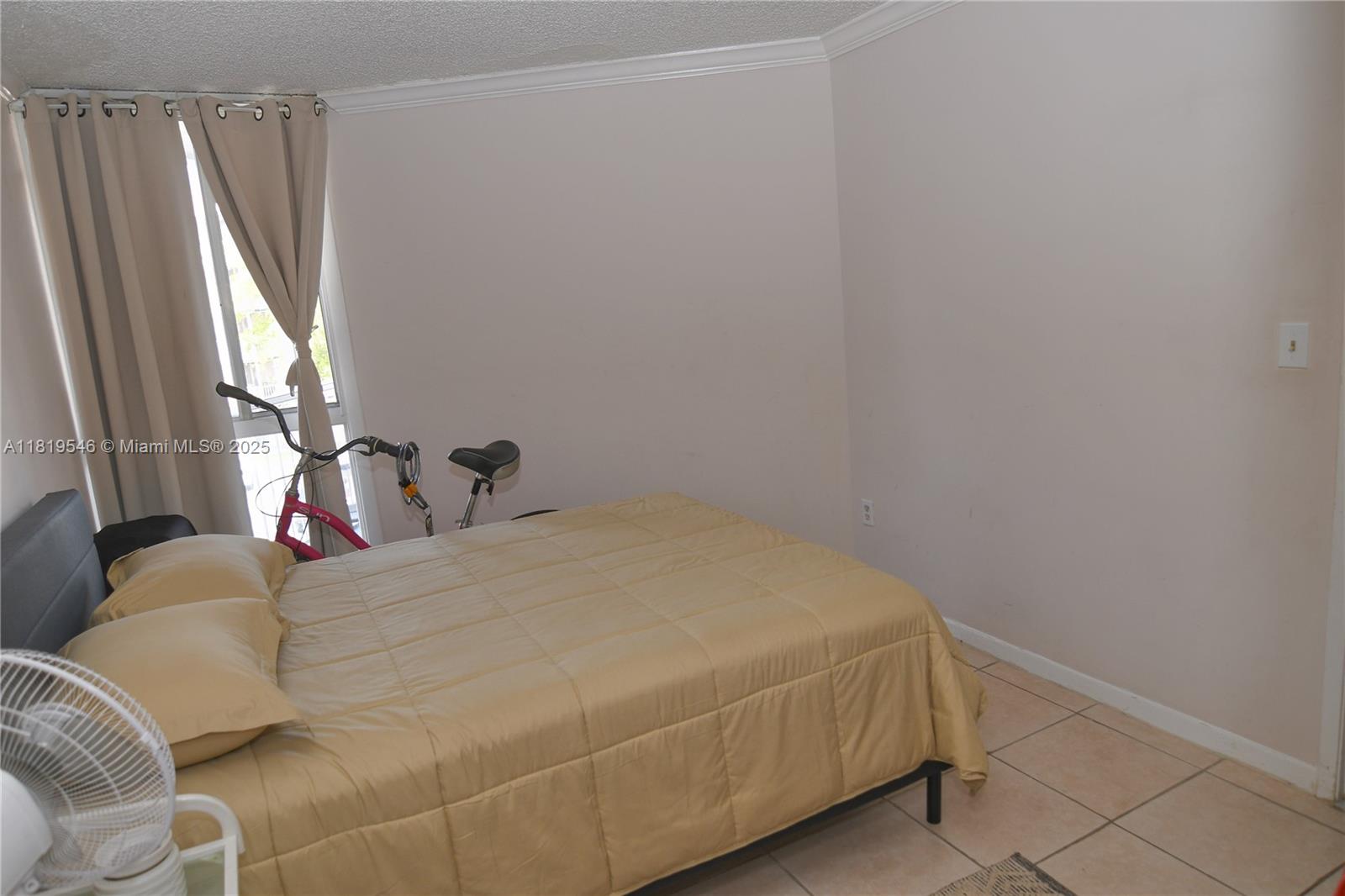 7125 Northwest 186th Street, Unit B311 Hialeah, FL 33015 - Photo 7 of 31 a bedroom with a bed and a window