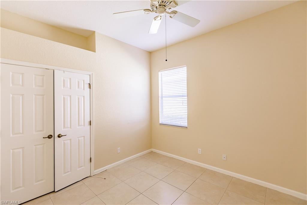 7868 Founders Circle Naples, FL 34104 - Photo 13 of 28 a view of an empty room with a window