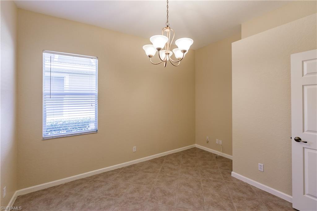 7868 Founders Circle Naples, FL 34104 - Photo 18 of 28 a view of a chandelier in a room