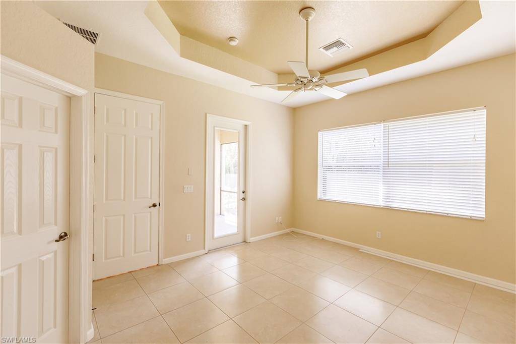 7868 Founders Circle Naples, FL 34104 - Photo 6 of 28 a view of an empty room with a window