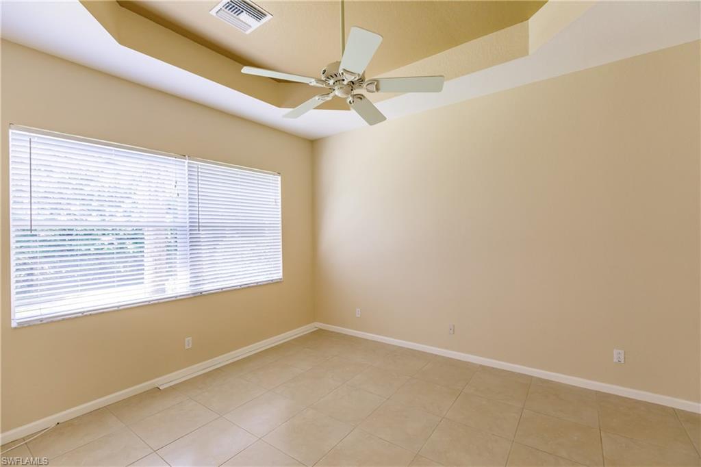 7868 Founders Circle Naples, FL 34104 - Photo 7 of 28 an empty room with a window
