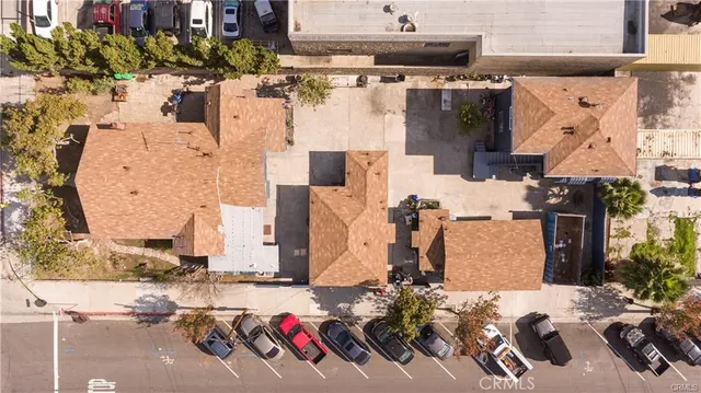 an aerial view of a house with a swimming pool