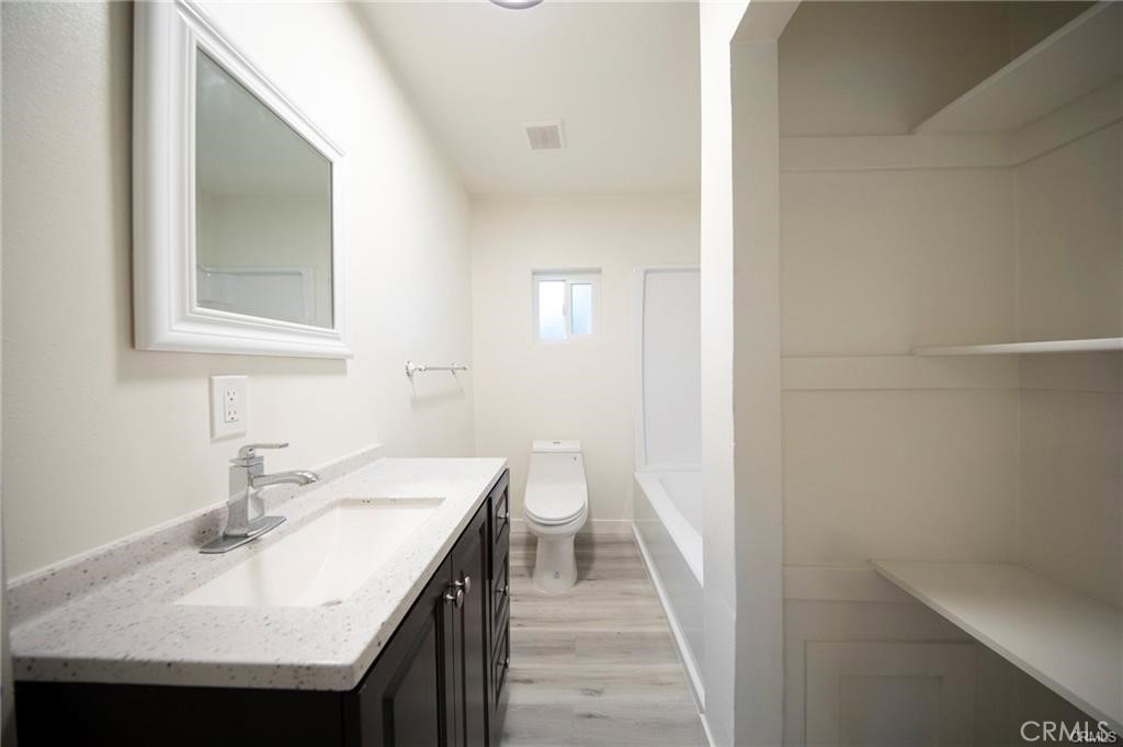 1452 West 134th Street Gardena, CA 90249 - Photo 9 of 18 a bathroom with a sink and a toilet