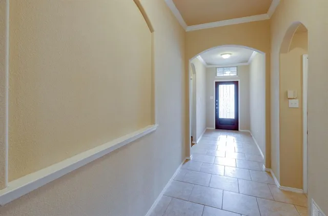 a view of a kitchen with a sink stove cabinets and stainless steel appliances