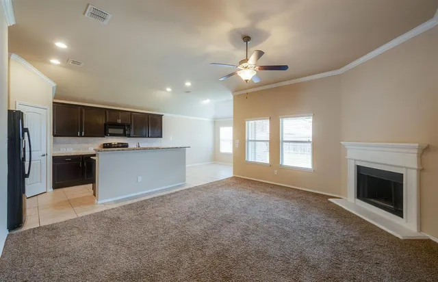 a view of a kitchen with a microwave and a kitchen view