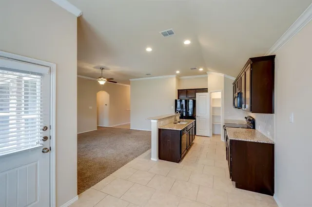 a view of a chandelier fan in a room