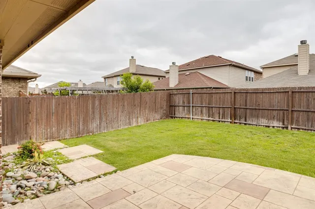a view of a backyard with a garden
