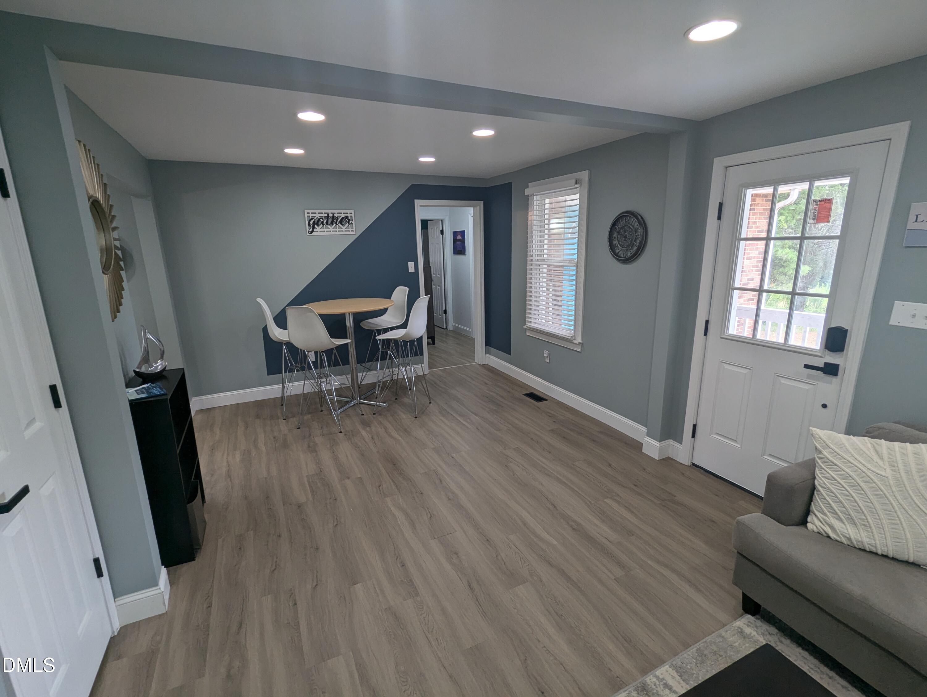 210 Grapevine Drive Roxboro, NC 27574 - Photo 14 of 31 a living room with furniture and a wooden floor