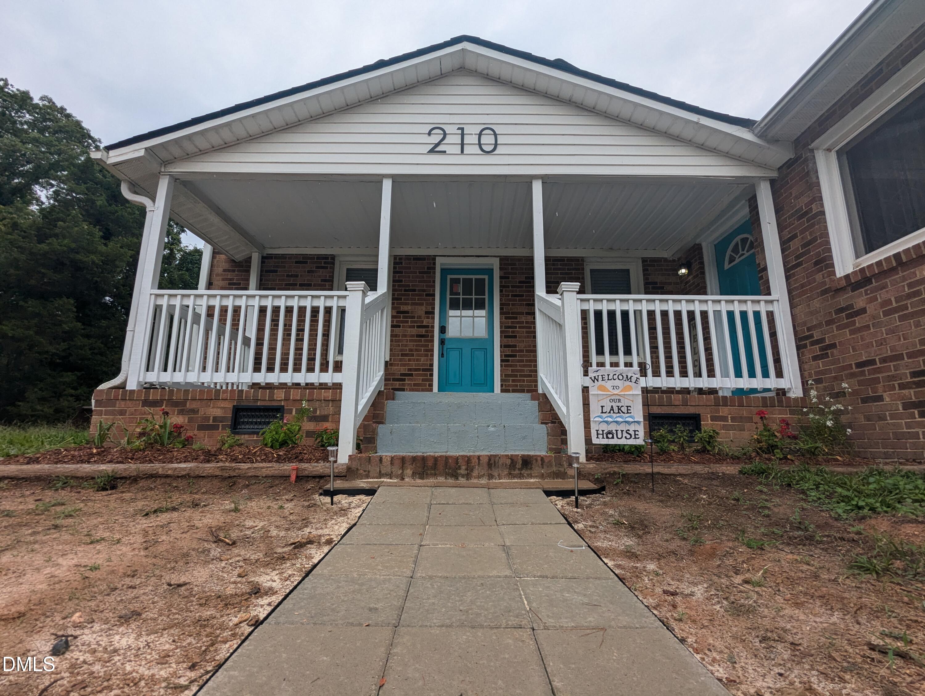 210 Grapevine Drive Roxboro, NC 27574 - Photo 2 of 31 a view of a house with a yard