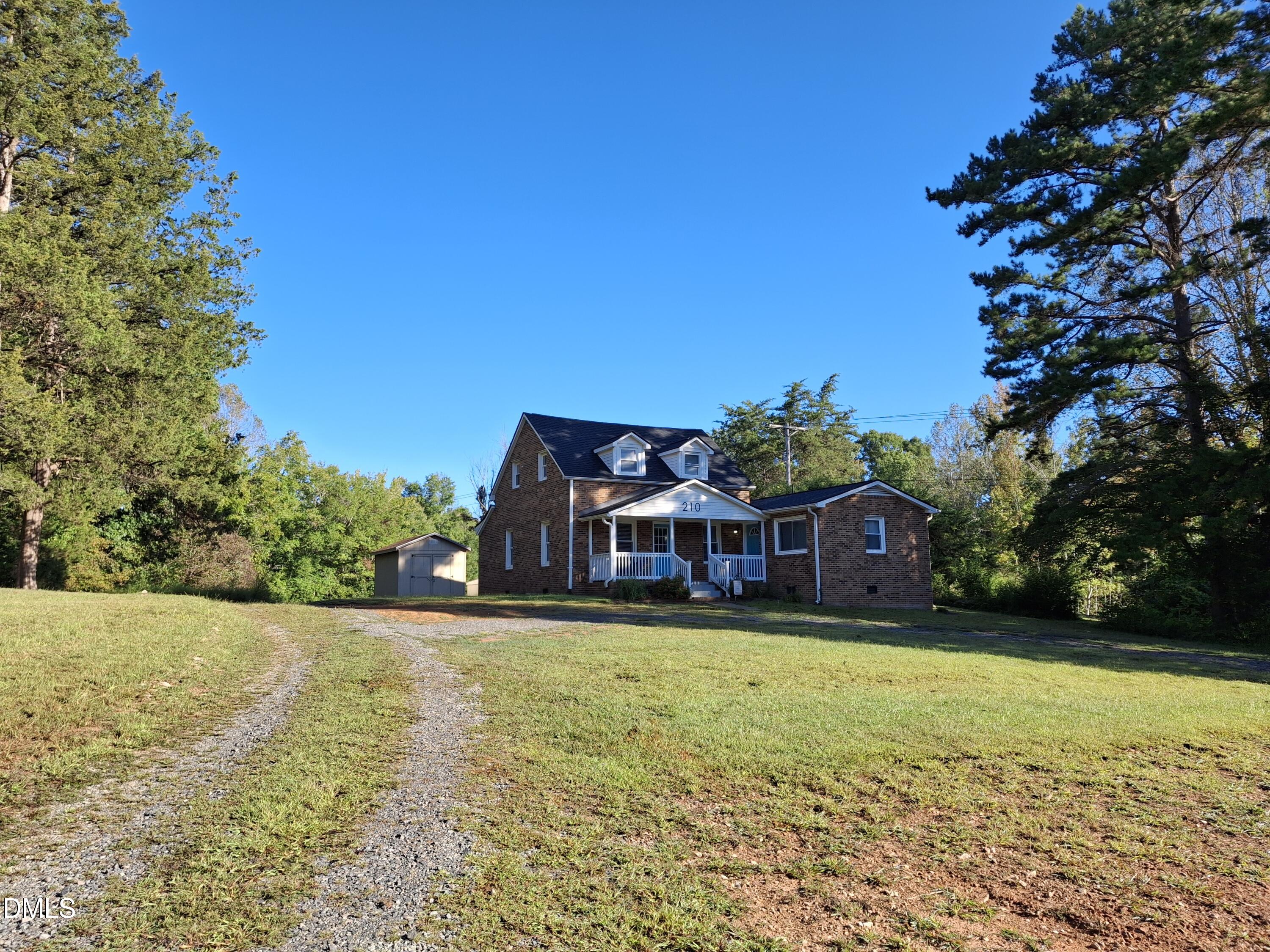 210 Grapevine Drive Roxboro, NC 27574 - Photo 23 of 31 a view of a house with swimming pool and yard