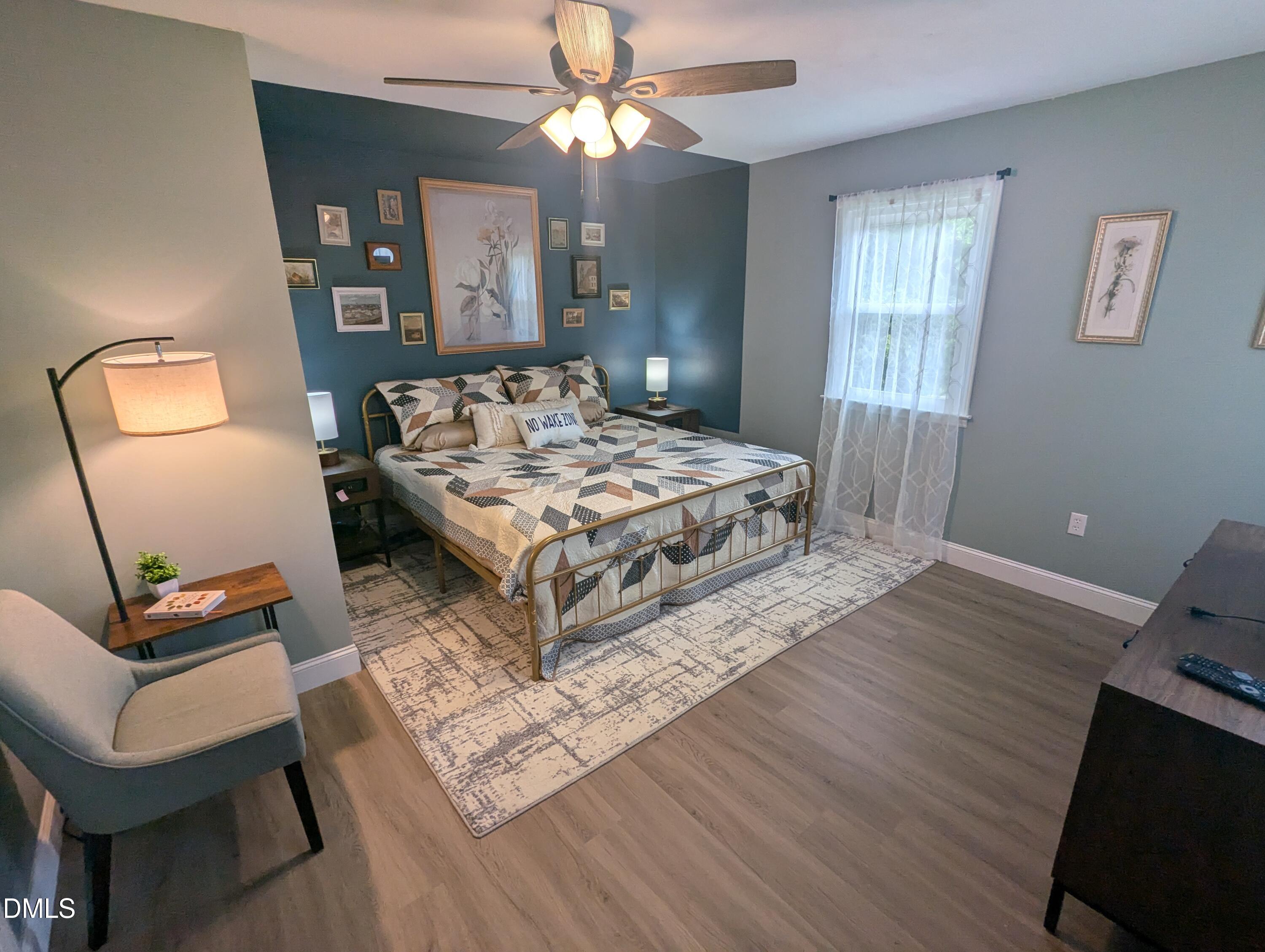 210 Grapevine Drive Roxboro, NC 27574 - Photo 5 of 31 a living room with a bed furniture and a window
