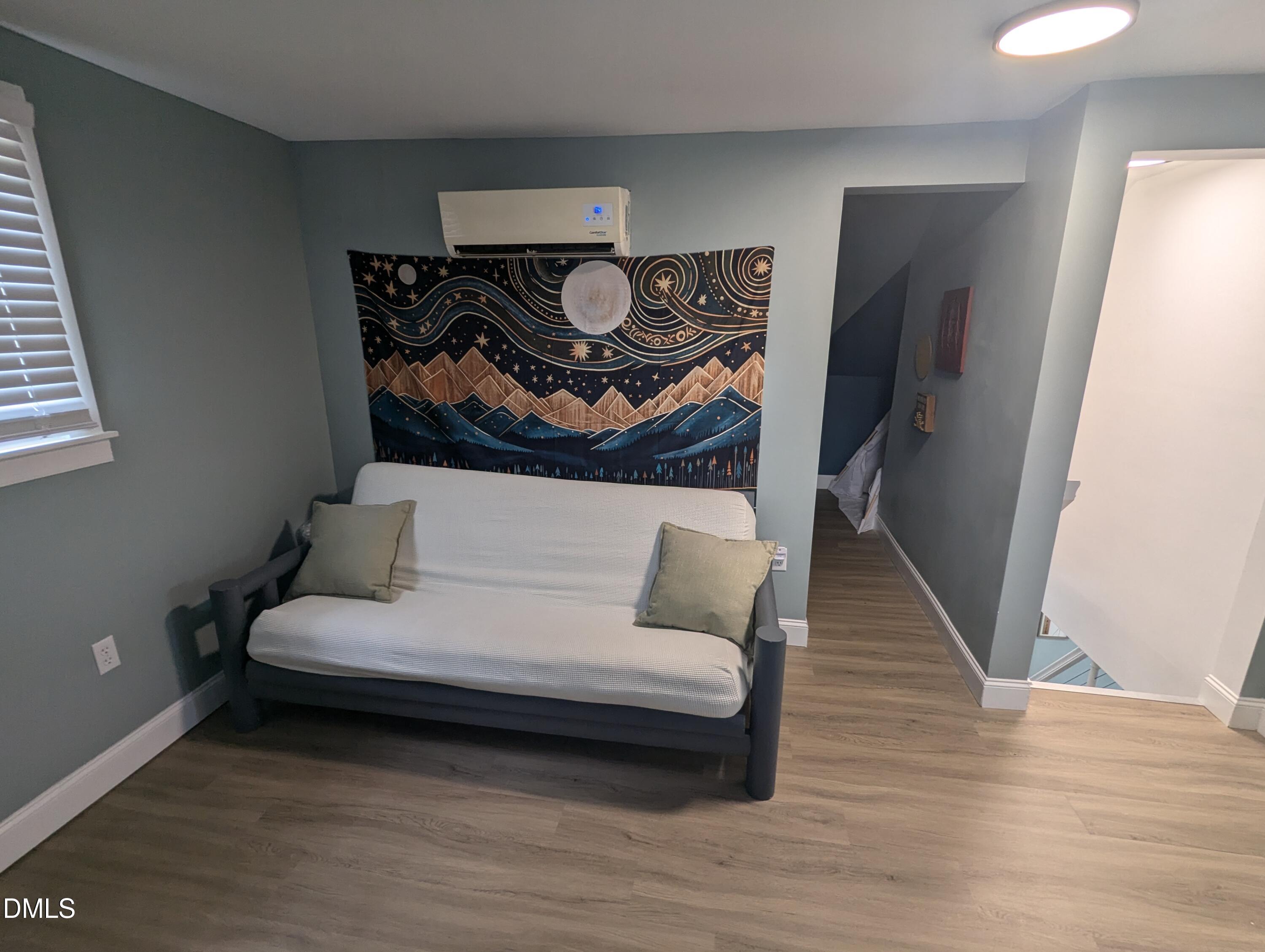 210 Grapevine Drive Roxboro, NC 27574 - Photo 8 of 31 a living room with furniture and a wooden floor