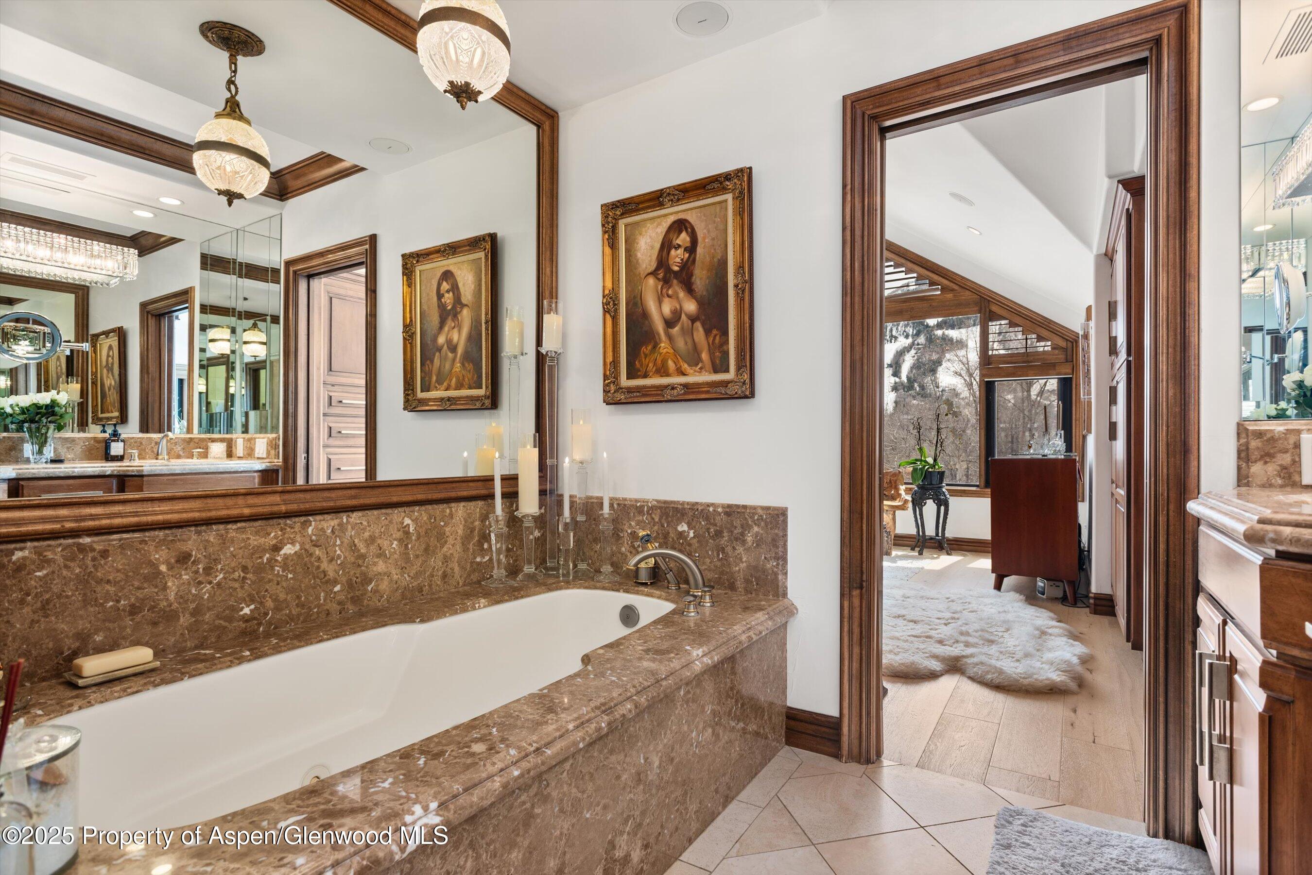 155 Lone Pine Road, Unit 9 Aspen, CO 81611 - Photo 13 of 27 a bath tub sitting next to a bathroom sink