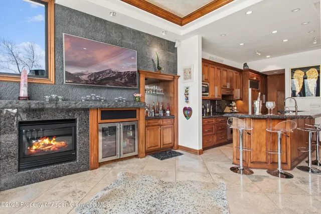 a large kitchen with stainless steel appliances granite countertop a stove and cabinets