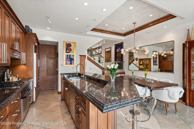 a dining room with furniture and a fireplace
