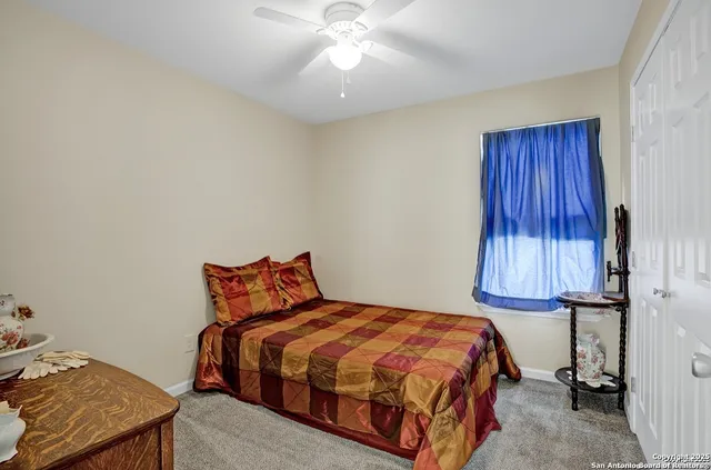 a bedroom with a bed and a table in it