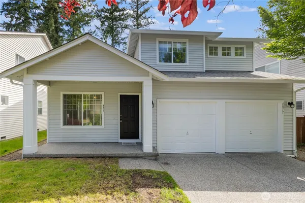 a view of a house with a yard