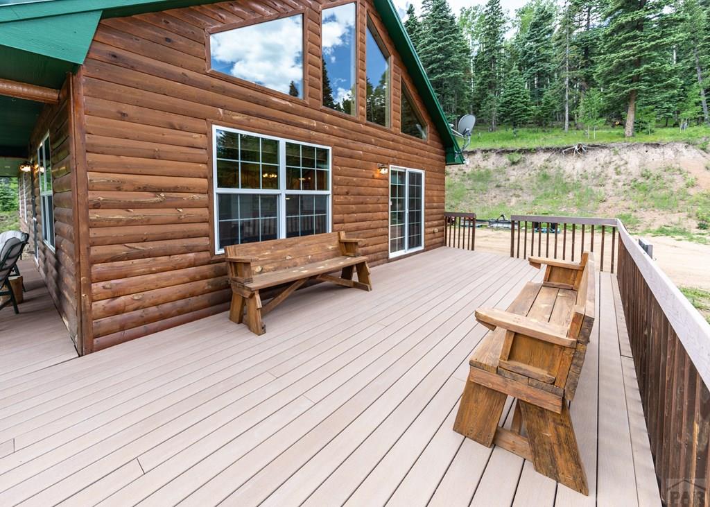 331 Westcliffe Drive Rye, CO 81069 - Photo 21 of 48 a balcony with wooden floor and outdoor seating