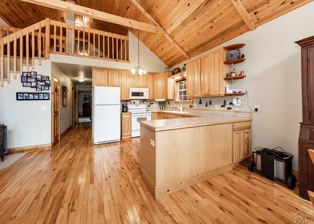 331 Westcliffe Drive Rye, CO 81069 - Photo 28 of 48 a kitchen that has a lot of cabinets in it