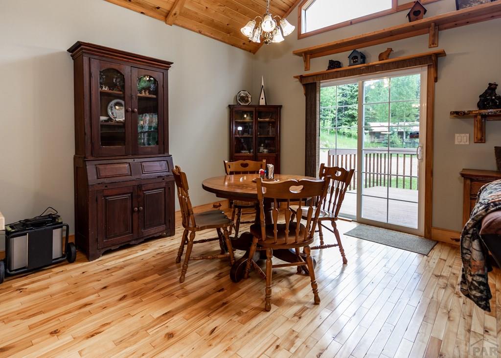 331 Westcliffe Drive Rye, CO 81069 - Photo 32 of 48 a dining room with furniture and wooden floor