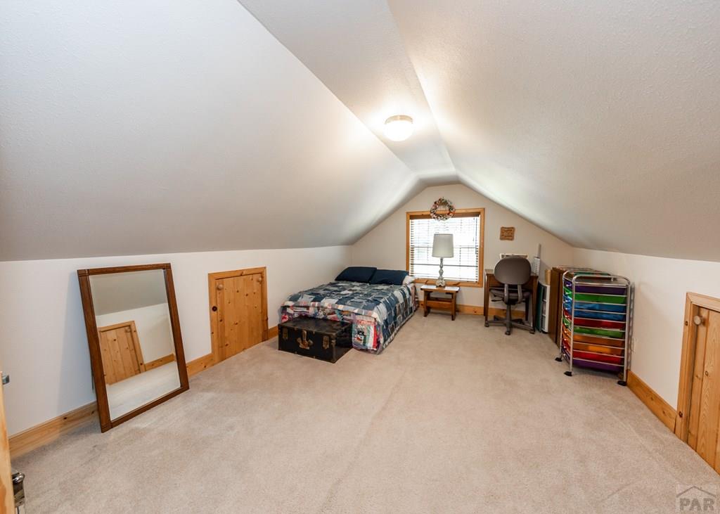 331 Westcliffe Drive Rye, CO 81069 - Photo 44 of 48 a big room with closet and baby crib
