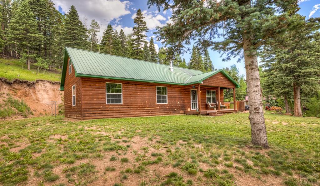 331 Westcliffe Drive Rye, CO 81069 - Photo 5 of 48 a front view of a house with garden