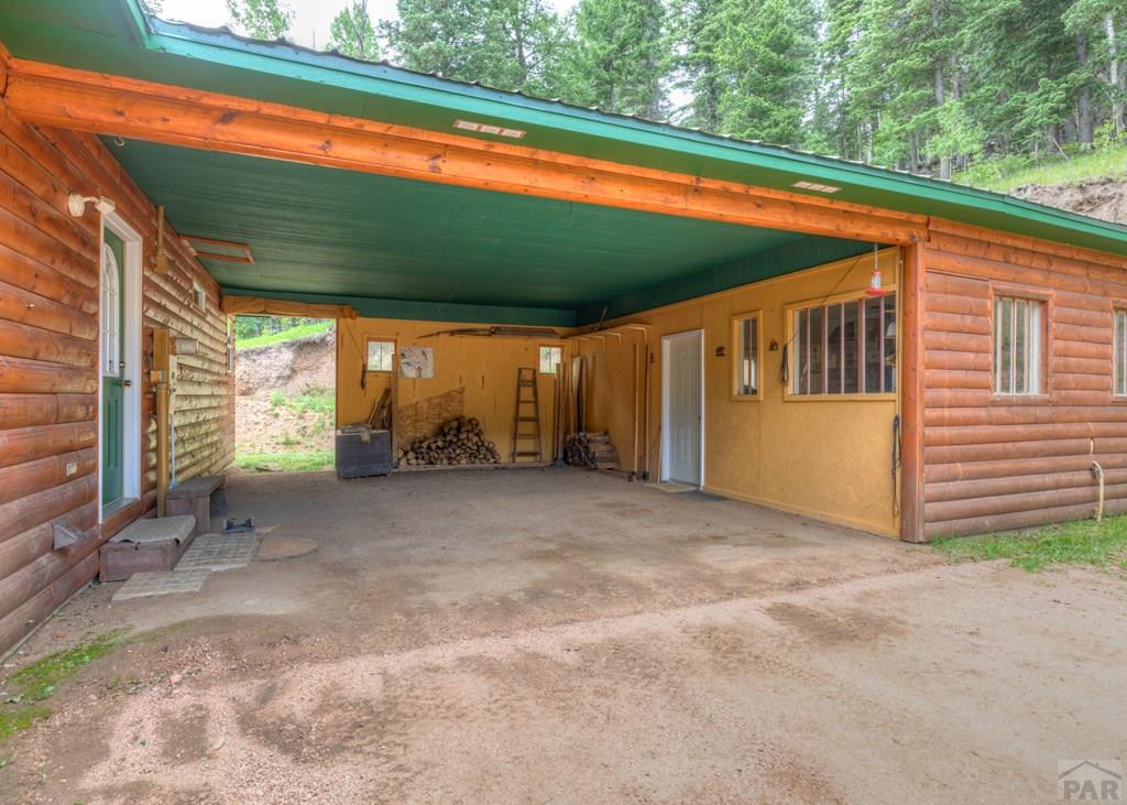331 Westcliffe Drive Rye, CO 81069 - Photo 7 of 48 a view of a backyard with large trees