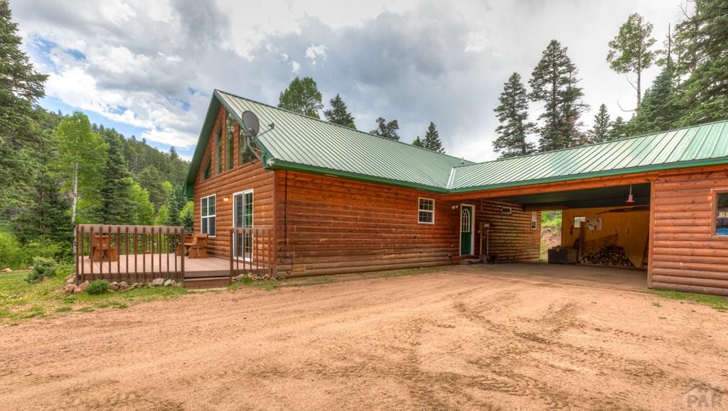 331 Westcliffe Drive Rye, CO 81069 - Photo 8 of 48 a view of a house with a yard and wooden fence