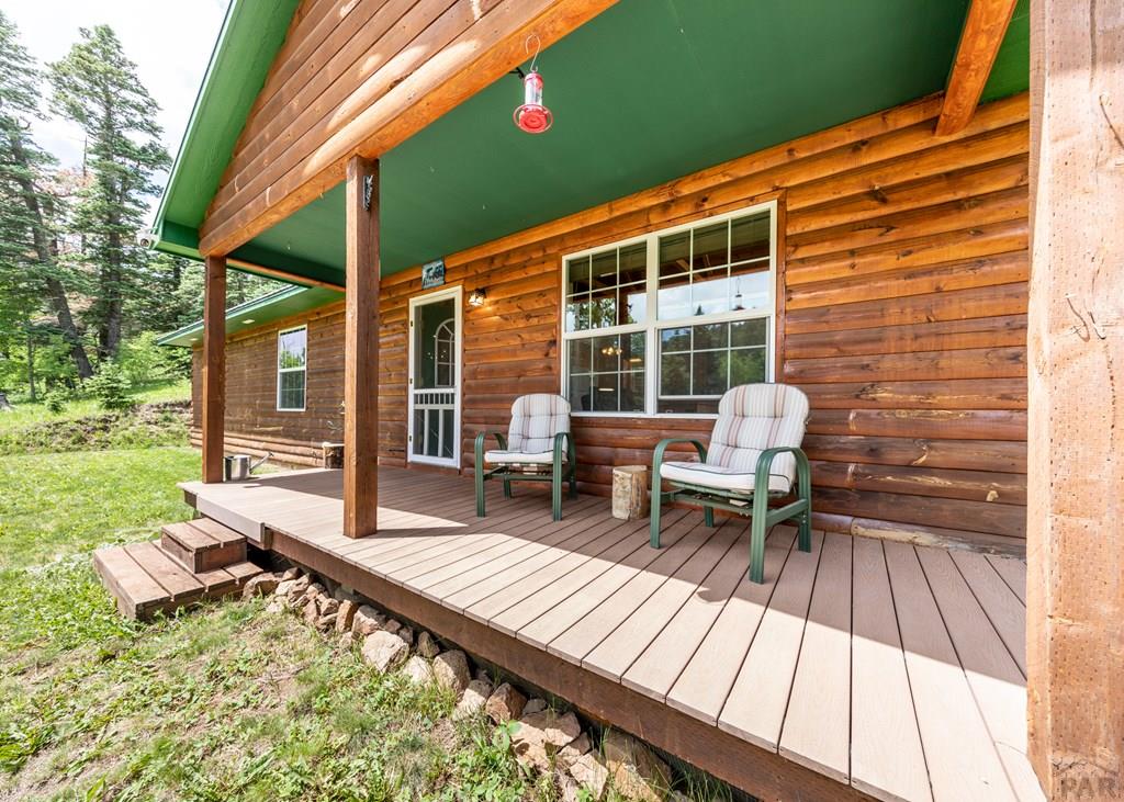 331 Westcliffe Drive Rye, CO 81069 - Photo 10 of 48 a backyard of a house with outdoor seating