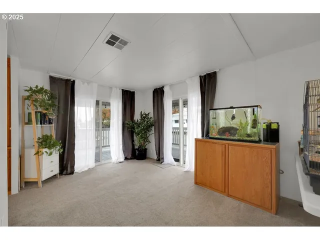a living room with furniture and view of living room