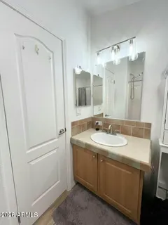 a bathroom with a double vanity sink mirror and double