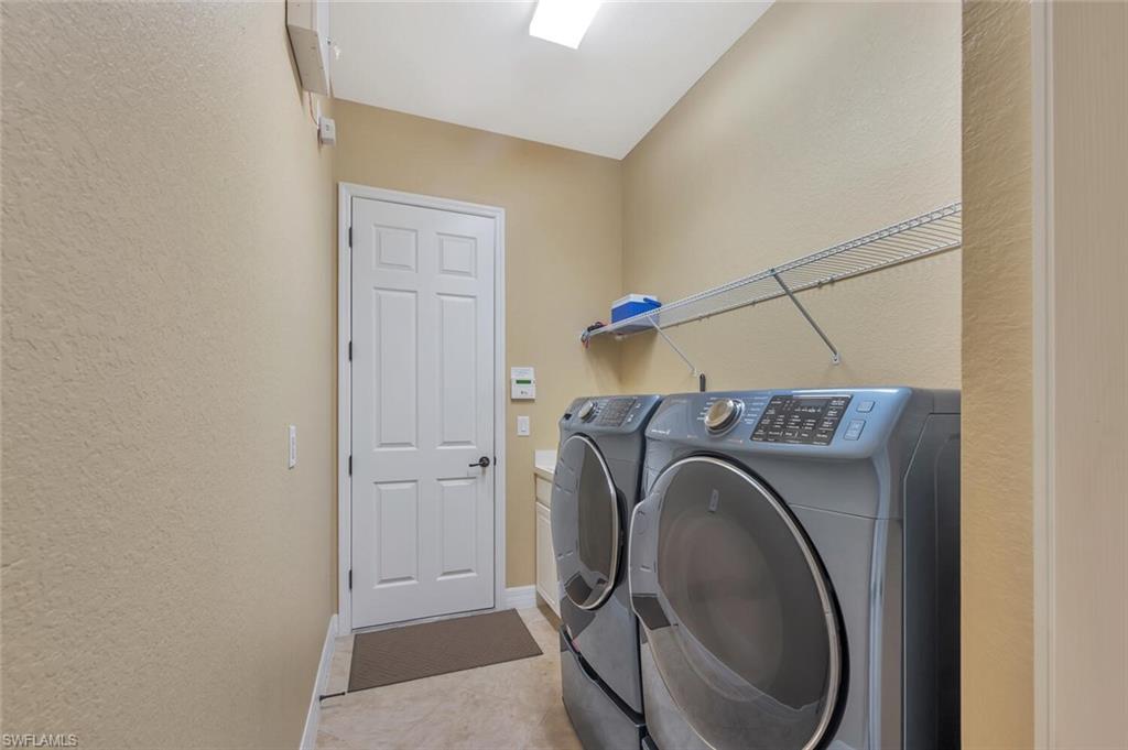 21093 Torre Del Lago Street Estero, FL 33928 - Photo 24 of 37 a utility room with dryer and washer