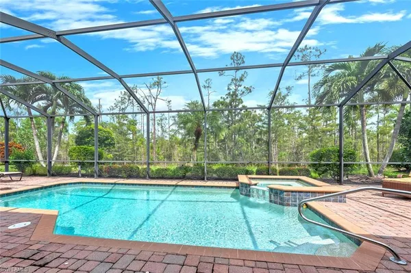 a view of swimming pool with outdoor seating
