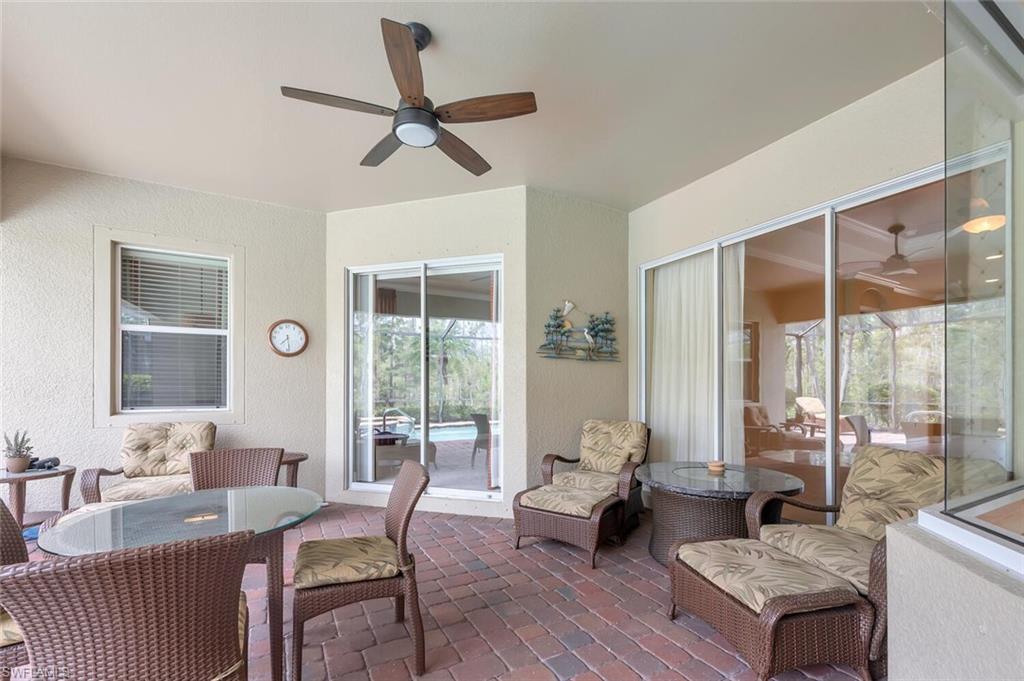 21093 Torre Del Lago Street Estero, FL 33928 - Photo 29 of 37 a living room with furniture and a large window