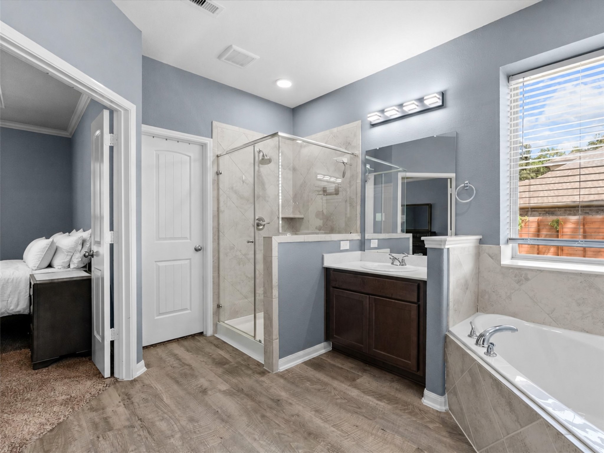 28619 Riverside Crest Lane Huffman, TX 77336 - Photo 22 of 48 The primary bath offers a separate shower, soaking tub and plenty of space to get ready with ease.