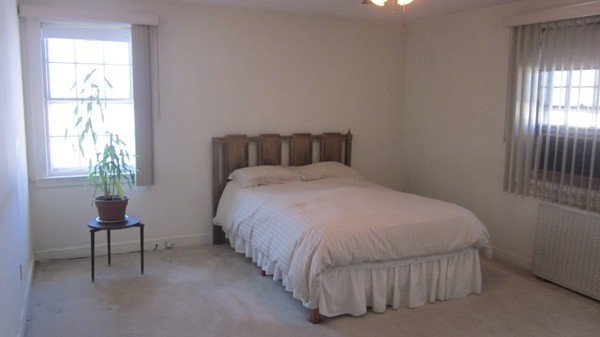 39 Sevinor Road Marblehead, MA 01945 - Photo 6 of 8 a bedroom with a bed and a window