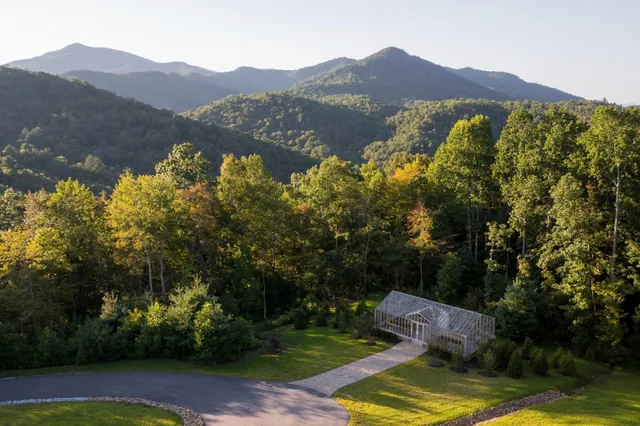 a bathroom with a sink a mirror and next to a window