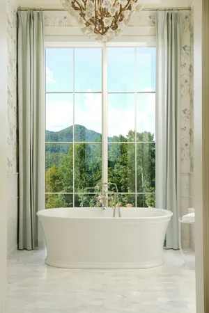 a view of a house with a yard fire pit and outdoor seating