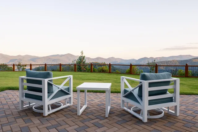a bedroom with a large bed and a large window