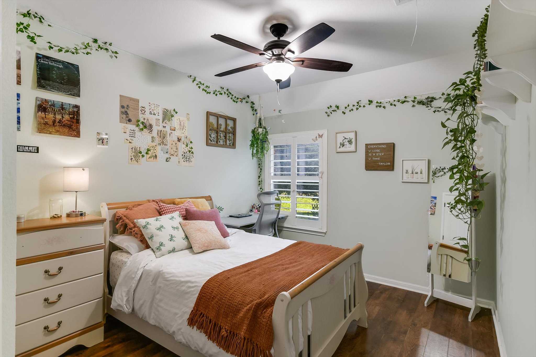 300 Wesley Ridge Drive Spicewood, TX 78669 - Photo 23 of 40 a bedroom with a bed and a chandelier