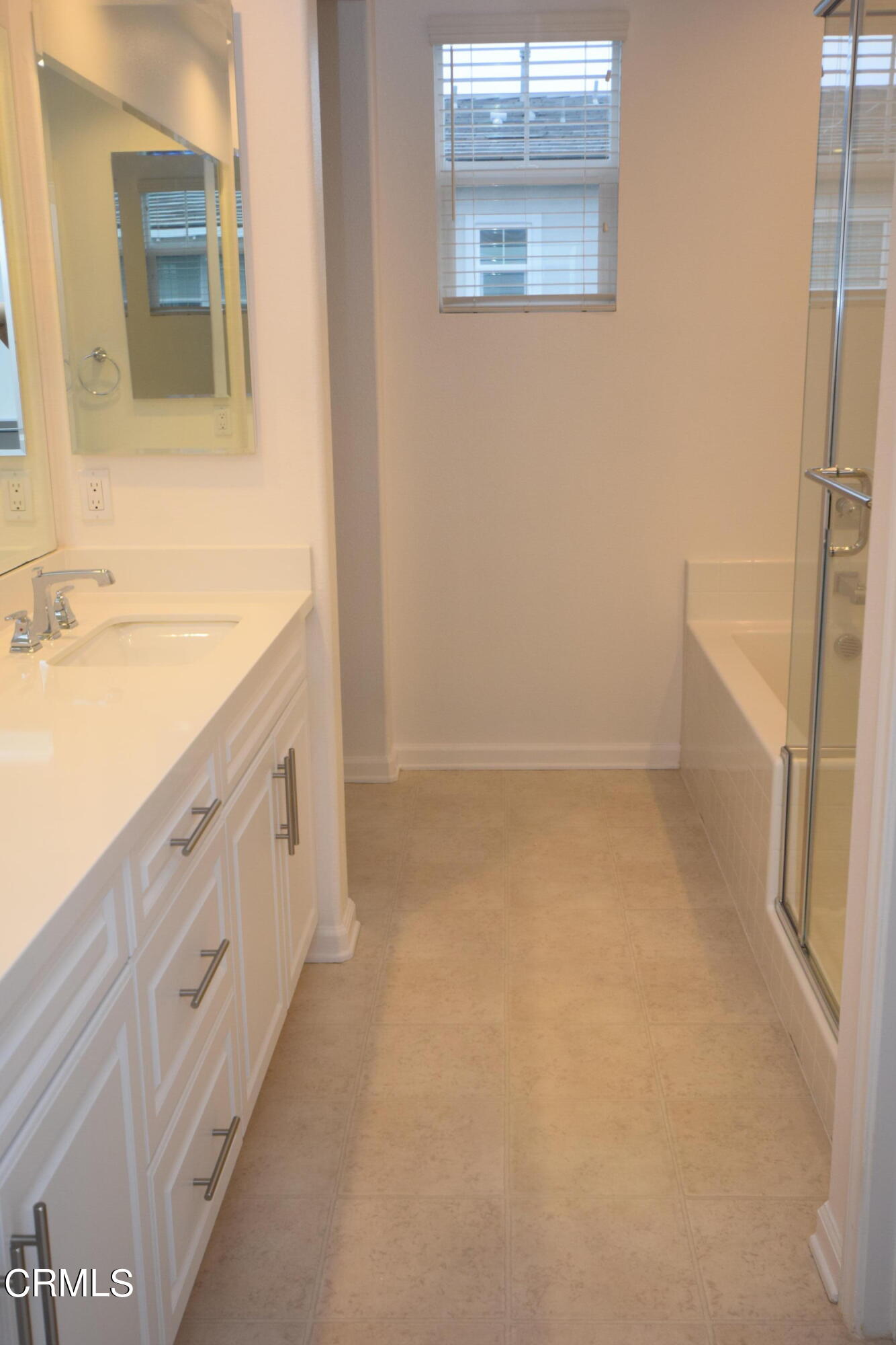 3755 Islander Walk Oxnard, CA 93035 - Photo 10 of 20 a bathroom with a sink a vanity and a mirror