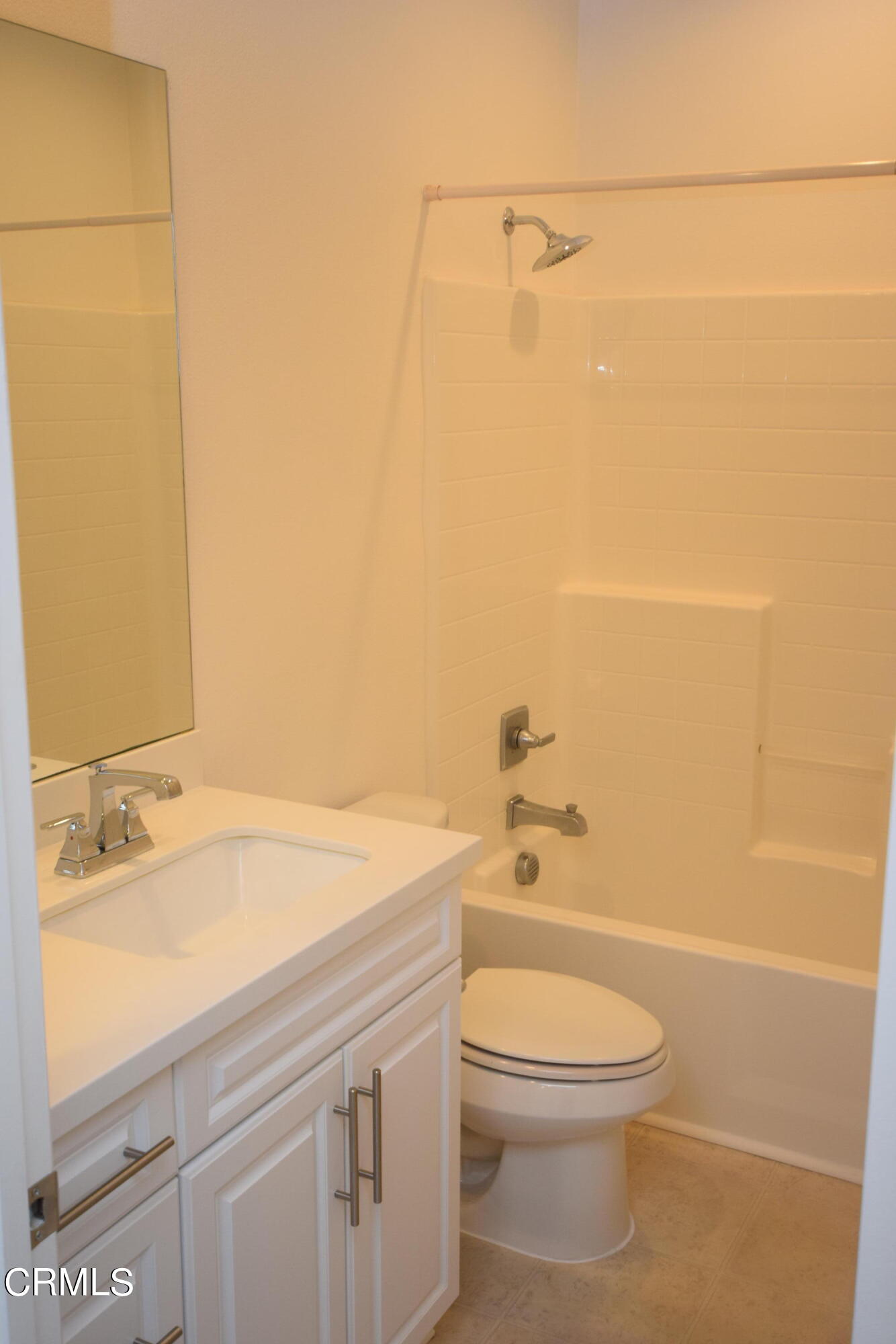 3755 Islander Walk Oxnard, CA 93035 - Photo 12 of 20 a bathroom with a sink a toilet and shower