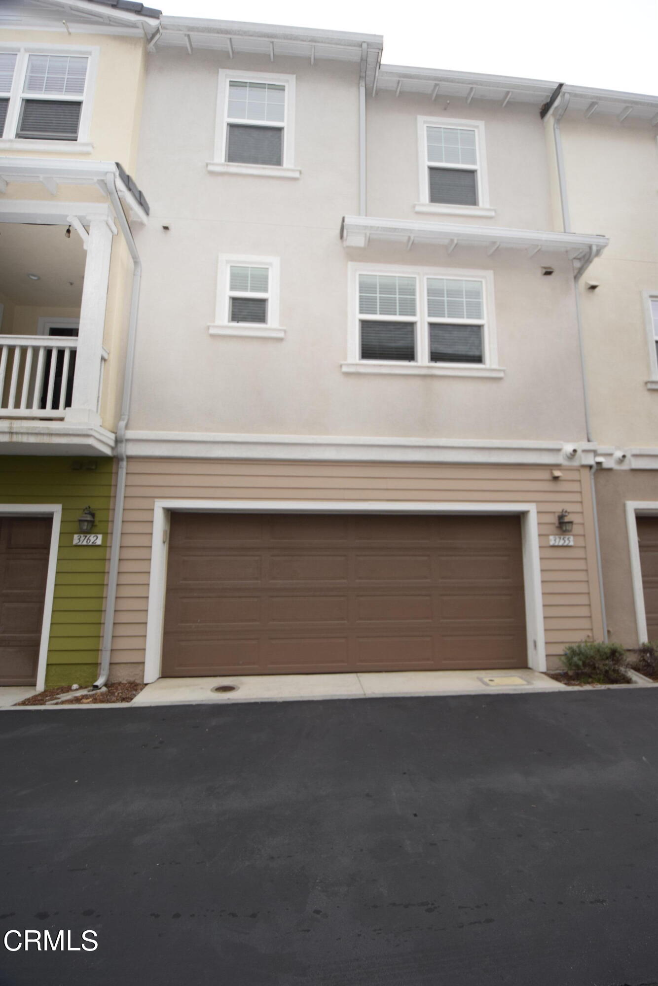 3755 Islander Walk Oxnard, CA 93035 - Photo 15 of 20 a front view of a house with a garage