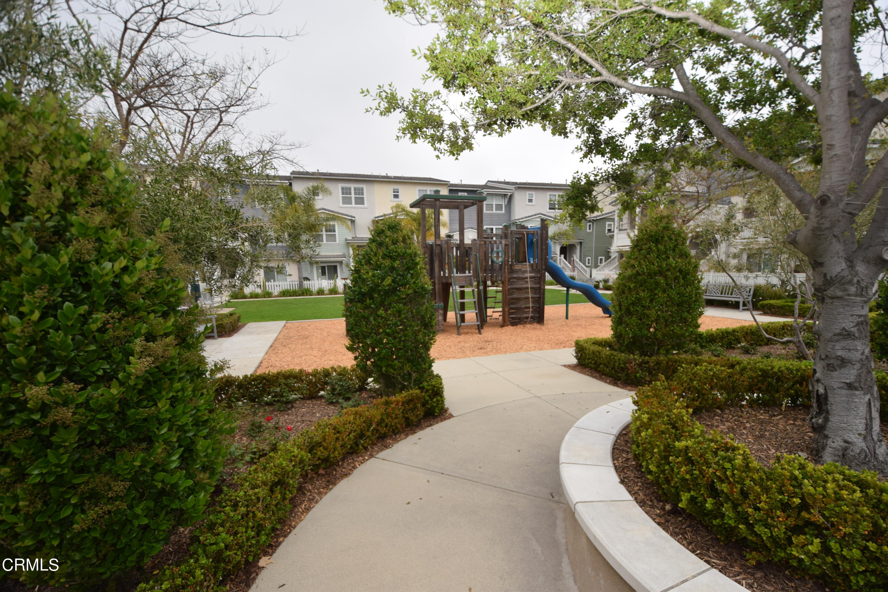 3755 Islander Walk Oxnard, CA 93035 - Photo 17 of 20 a view of a house with a yard and potted plants