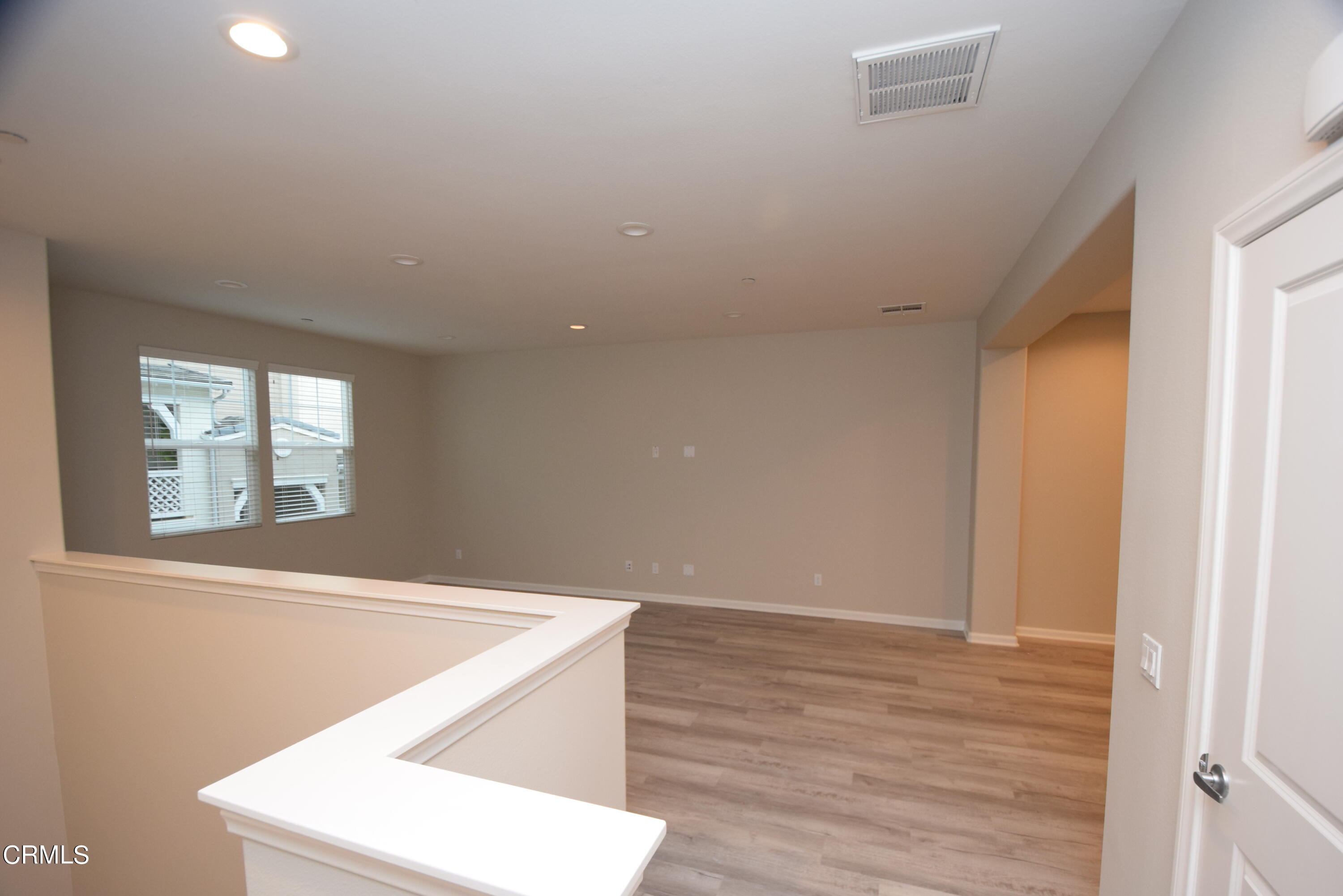 3755 Islander Walk Oxnard, CA 93035 - Photo 20 of 20 a view of an empty room with wooden floor and a window