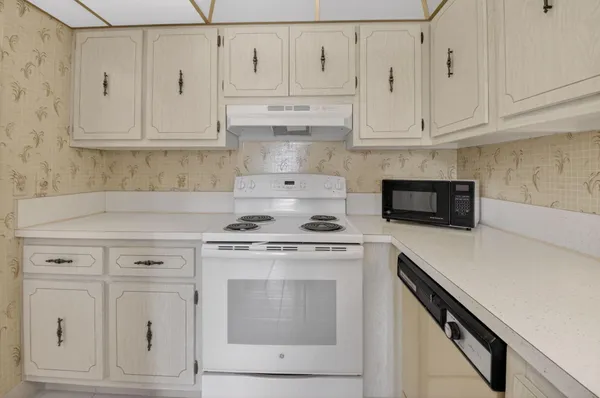 a view of a dining room with furniture and a livingroom